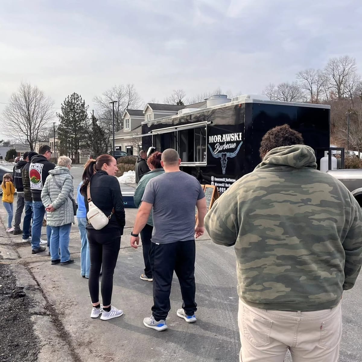 Guests ordering at the Morawski Barbecue trailer at a brewery event